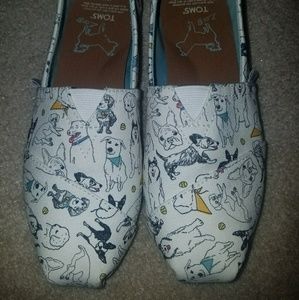 Tom's with dogs/puppies